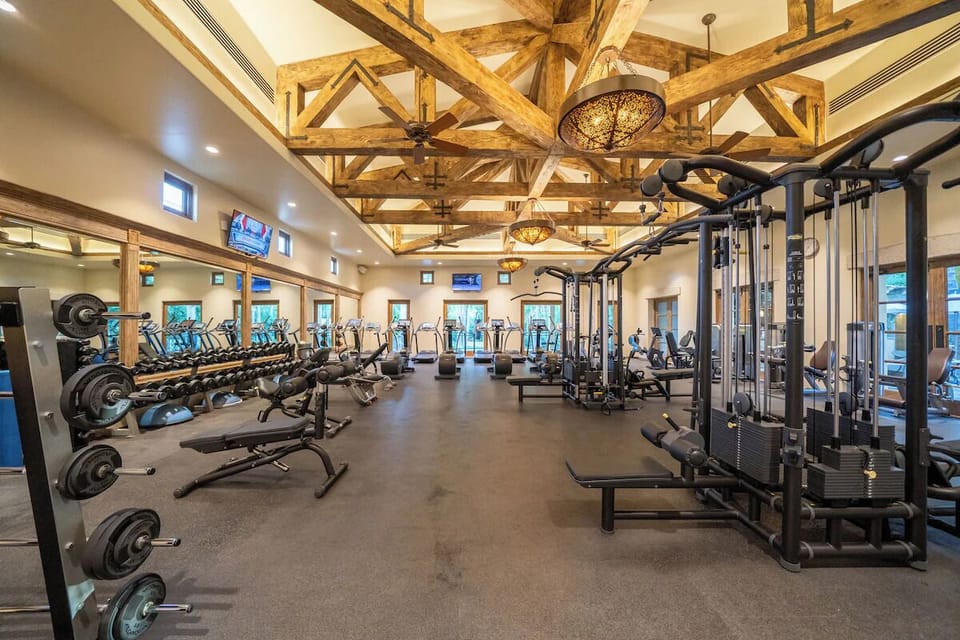 Energize your day in a spacious gym with resort-style beams