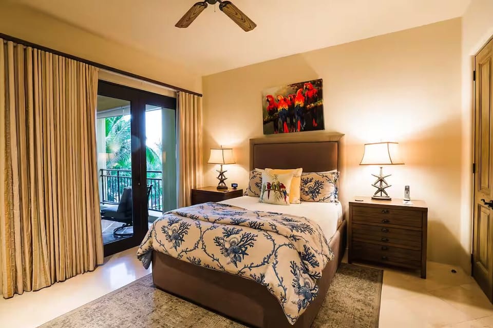 Unwind in plush bedding after a day in paradise.