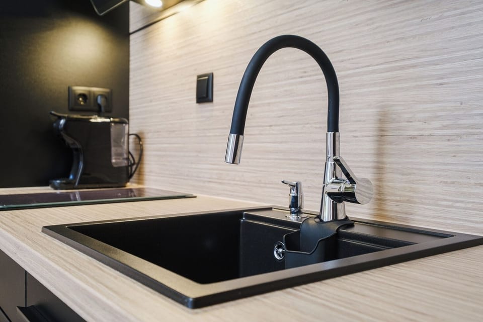 Well-organized kitchen with modern finish and all basics provided for a comfortable, self-catering stay.