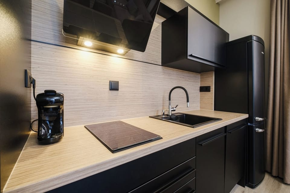 Stylish, compact kitchen with essentials for easy meal prep. Ideal for longer stays or guests who prefer home-cooked meals.