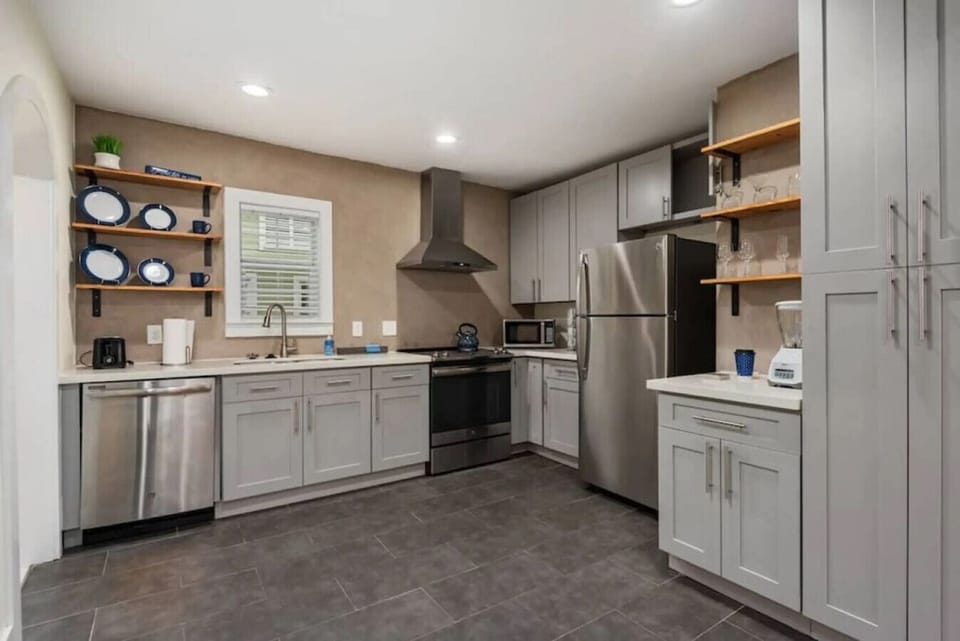 A fully equipped kitchen with modern appliances and plenty of counter space. Cook breakfast together and save on dining out all trip.