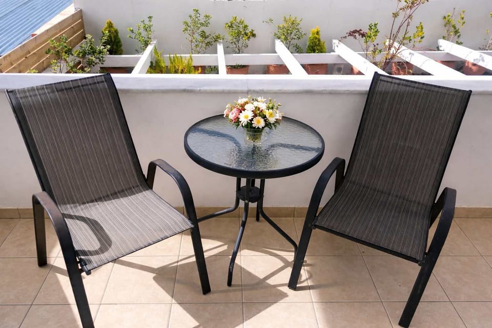 Enjoy your morning coffee or evening drinks on the private balcony with comfortable outdoor seating. A perfect spot to relax and take in the peaceful atmosphere during your stay in Crete