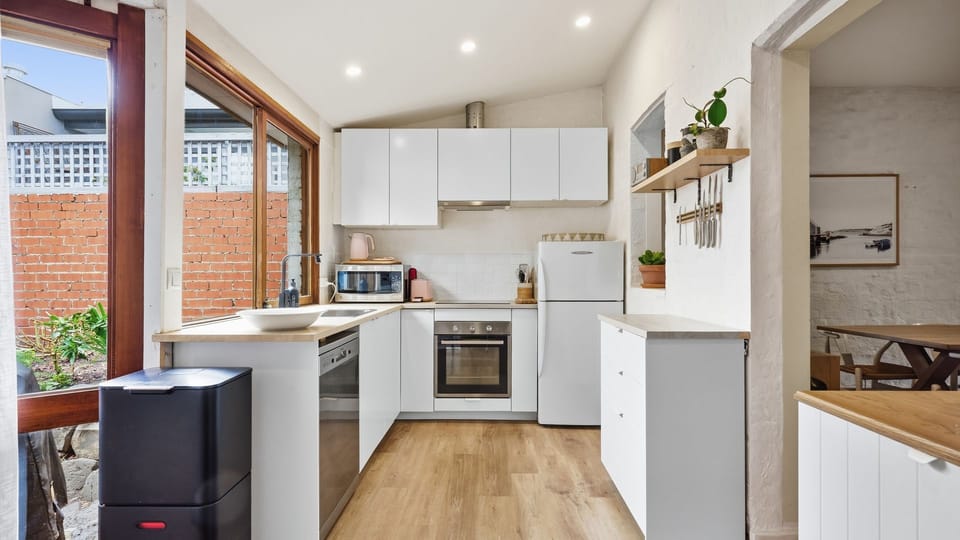 Bright and airy kitchen with seamless indoor–outdoor flow