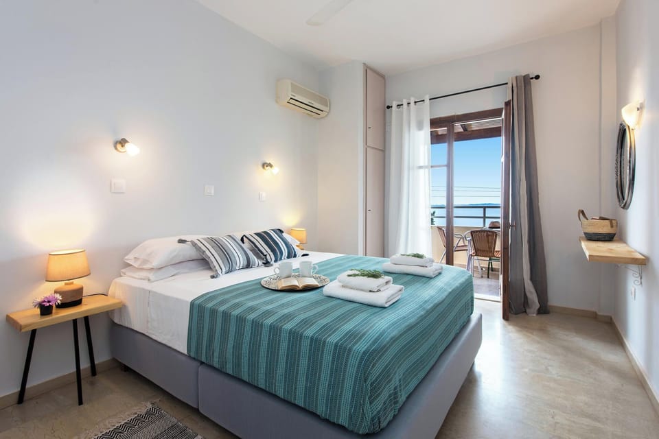Bedroom 1: Comfortable double bedroom with natural light and direct access to a private balcony. 