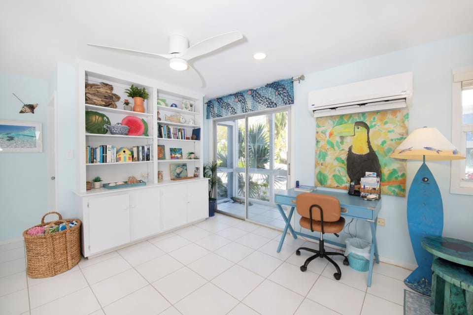 The home comes stocked with books, board games, and a desk + chair for remote work. 