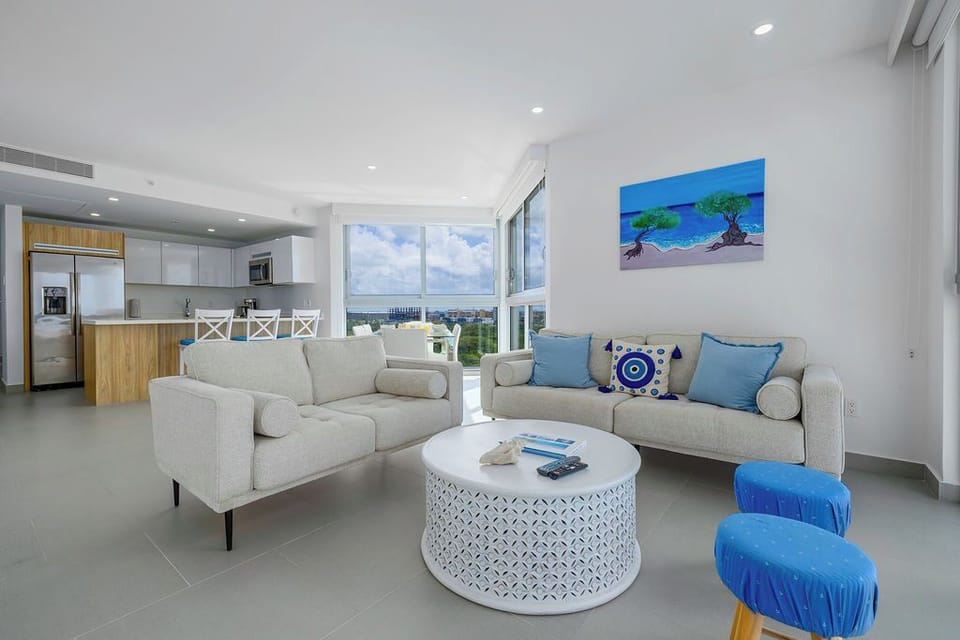 Relax in your bright, modern living space with ocean views and a fully equipped kitchen for memorable meals.