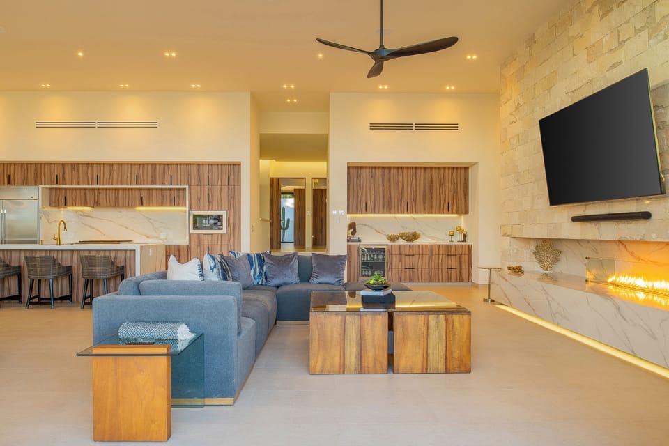Unwind in this stunning open-concept space where marble meets warm wood. Your living room flows into a gourmet kitchen, complete with cozy fireplace.