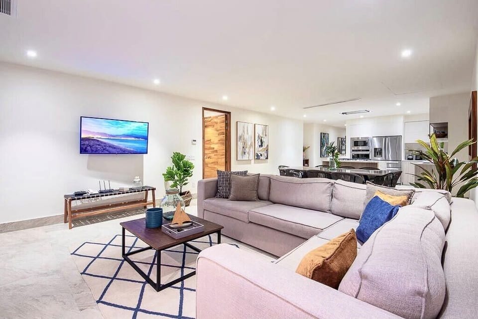 Open-concept living space connecting the lounge, dining, and kitchen