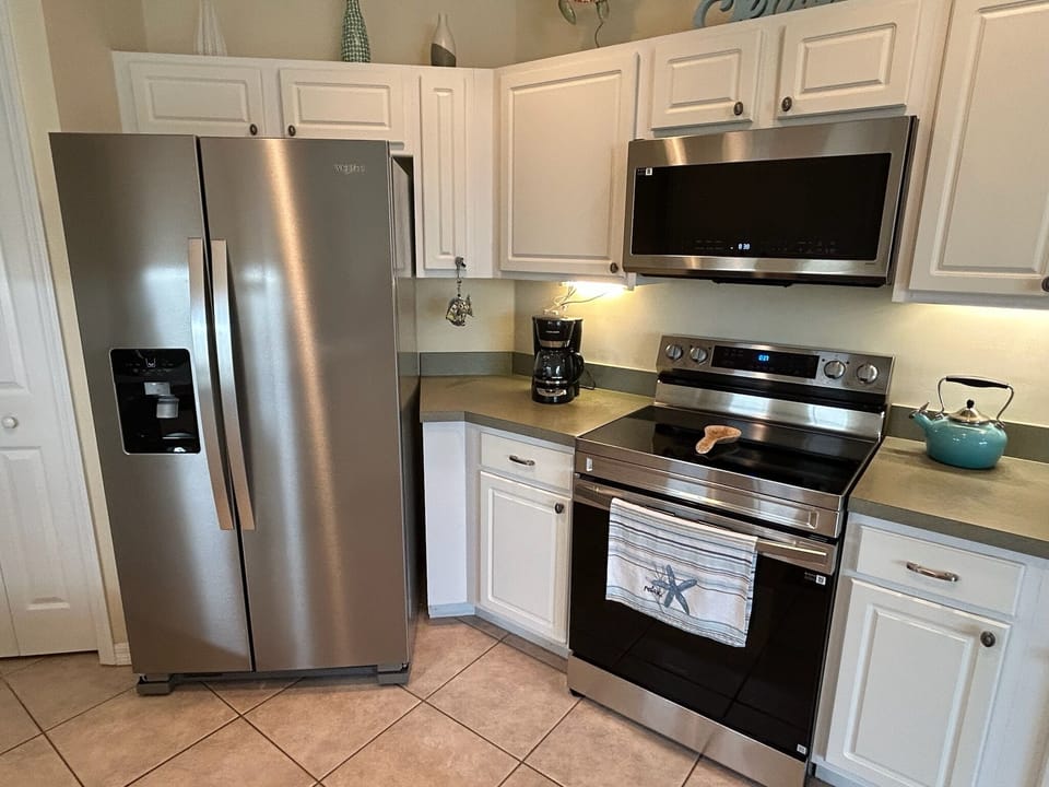 Your fully equipped kitchen awaits with stainless steel appliances, spacious counters, and everything you need to create memorable meals during your stay.