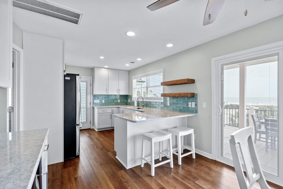 Bright, modern kitchen with spacious island and outdoor access