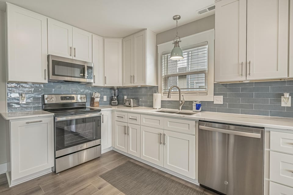 Bright, modern kitchen with stainless steel appliances and ample counter space