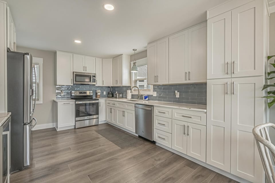 Modern kitchen with stainless steel appliances and spacious cabinetry