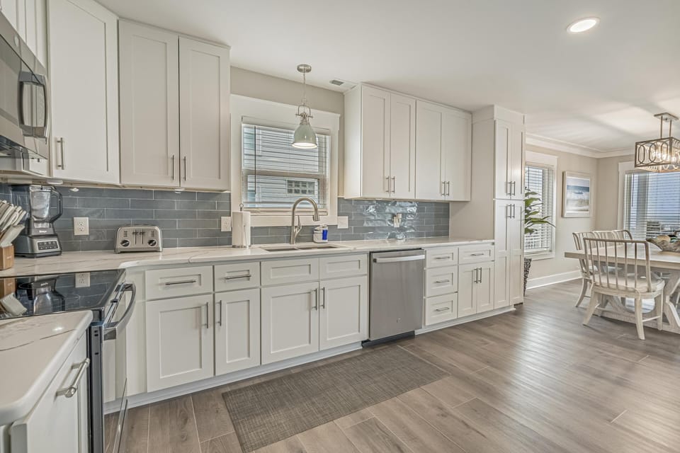 Bright, modern kitchen with spacious dining area and natural light