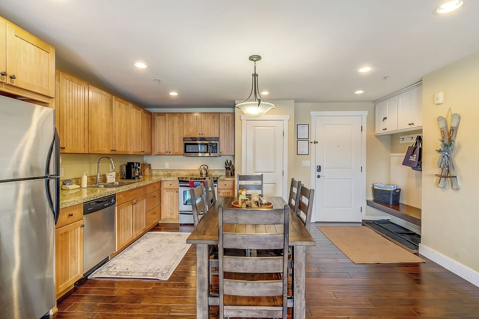 Your fully equipped kitchen awaits with granite counters, stainless appliances, and a cozy dining nook for memorable meals together.