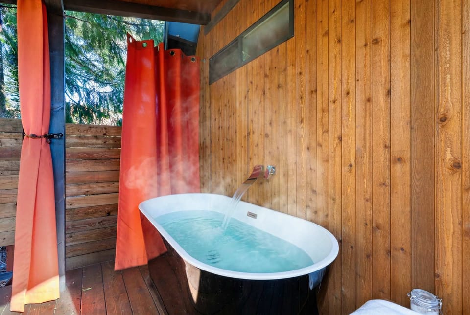 Because baths are better under the open sky, preferably with a drink in hand and stress far away.