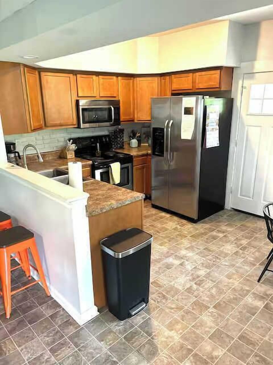 Your next home cooked meal awaits! The kitchen sits just near the backdoor to the backyard!