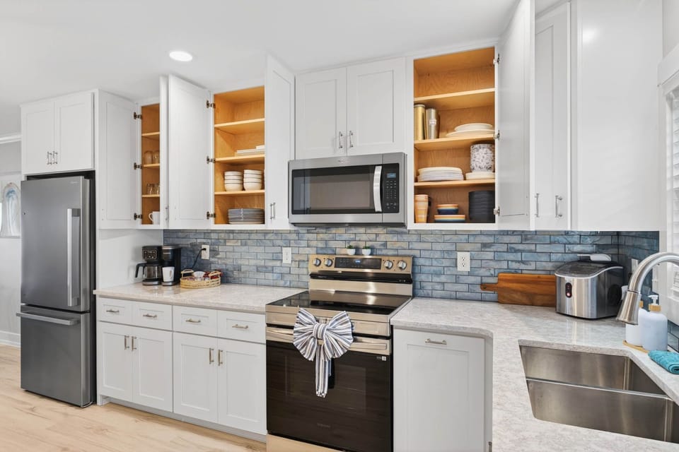 Fully stocked cabinets, a dual coffee maker, and ice maker.