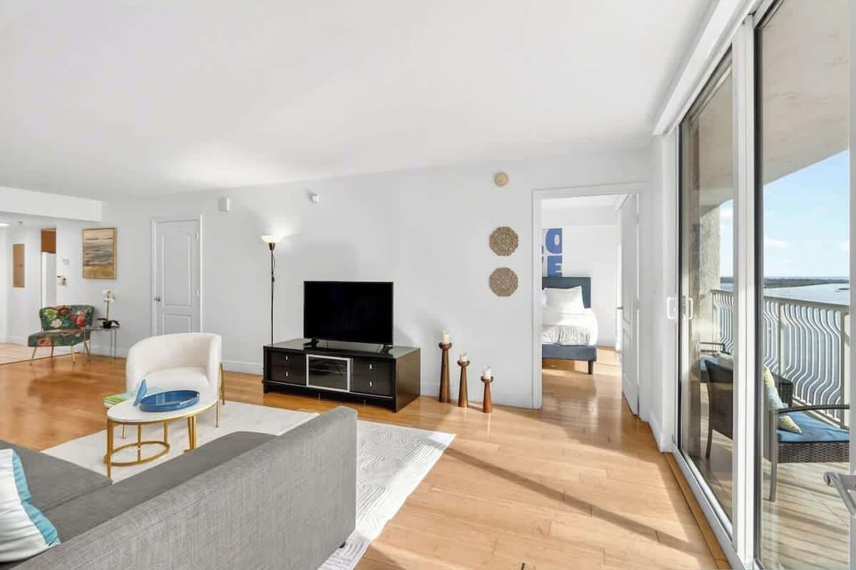 Bright living area with comfortable seating and Smart TV