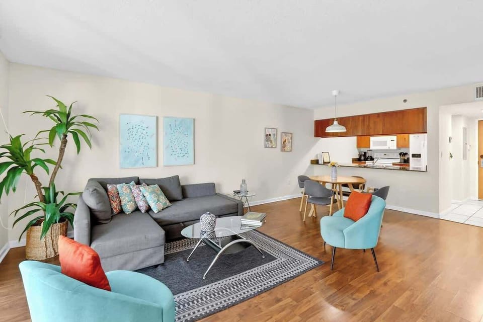 Bright living space with comfortable seating and Smart TV