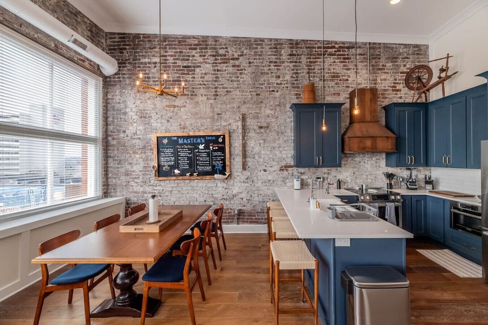 Dining Area: Gather around the stylish table amidst chic decor and warm, inviting lighting!
