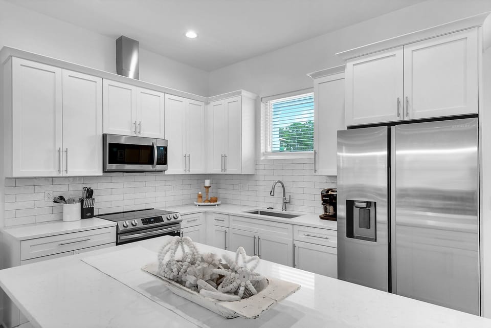 New stainless appliances and quartz counters in Bliss's well-stocked kitchen!
