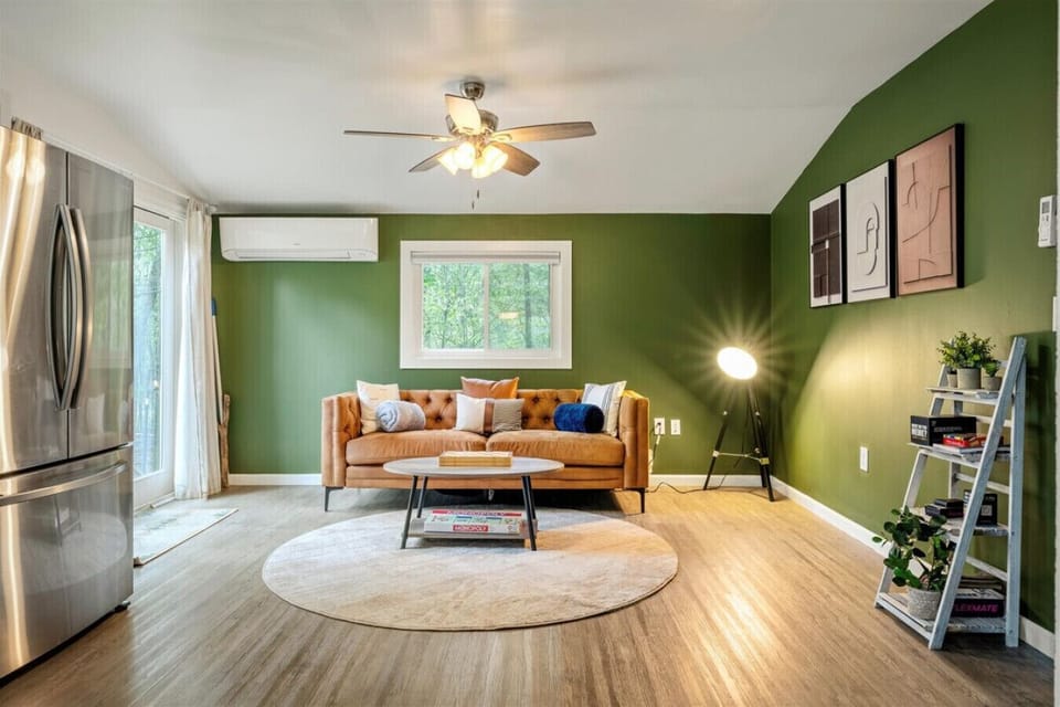 Just off the kitchen, you`ll find another cozy living space featuring a comfortable couch and center table—perfect for relaxing or enjoying a game night.