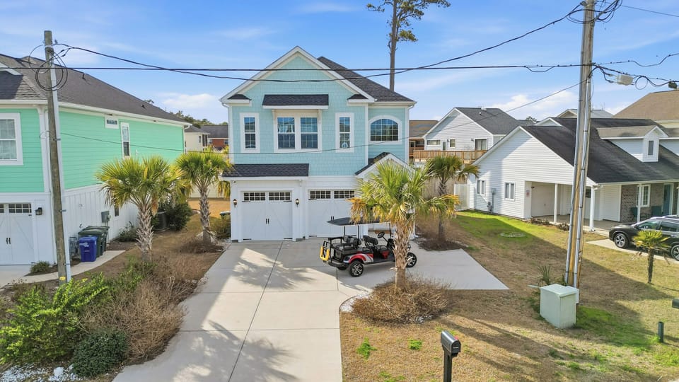 Your coastal getaway starts here—private driveway, palm trees, and beach vibes just 2 blocks away. 🌴🏖️
