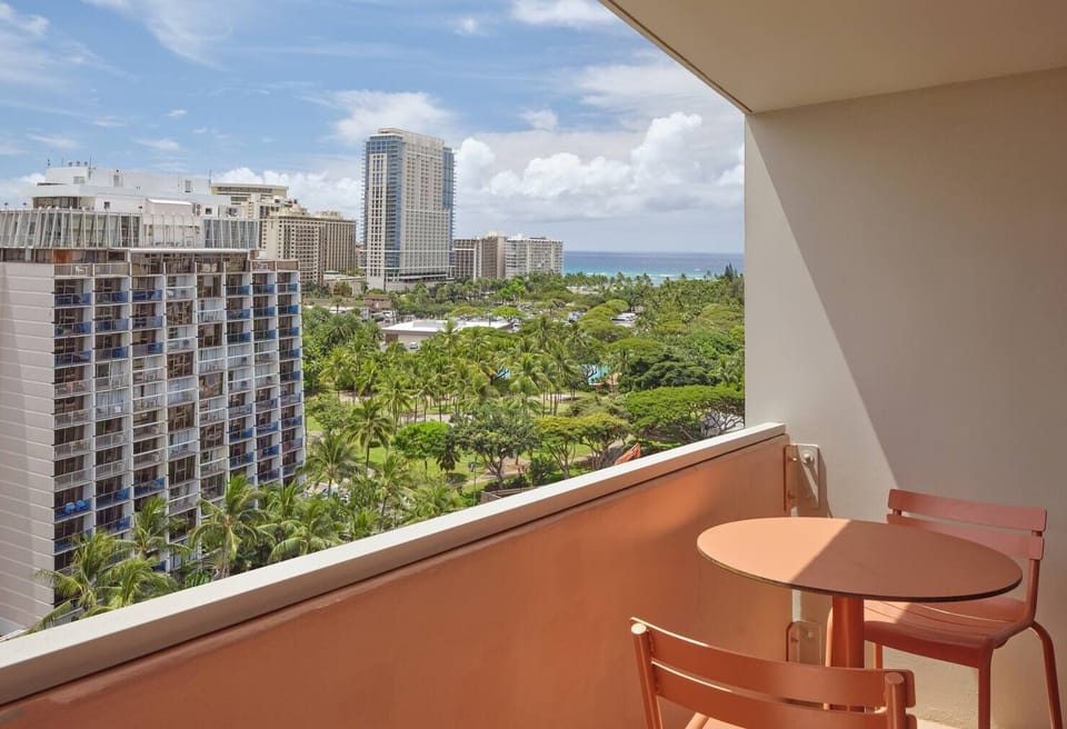 Sip morning coffee on the balcony with ocean-peek city views.