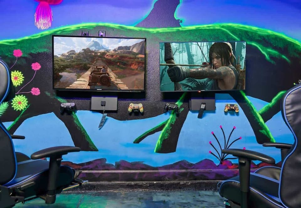 Gaming Paradise: Unleash your inner gamer with dual screens and epic decor in this fun-filled retreat!