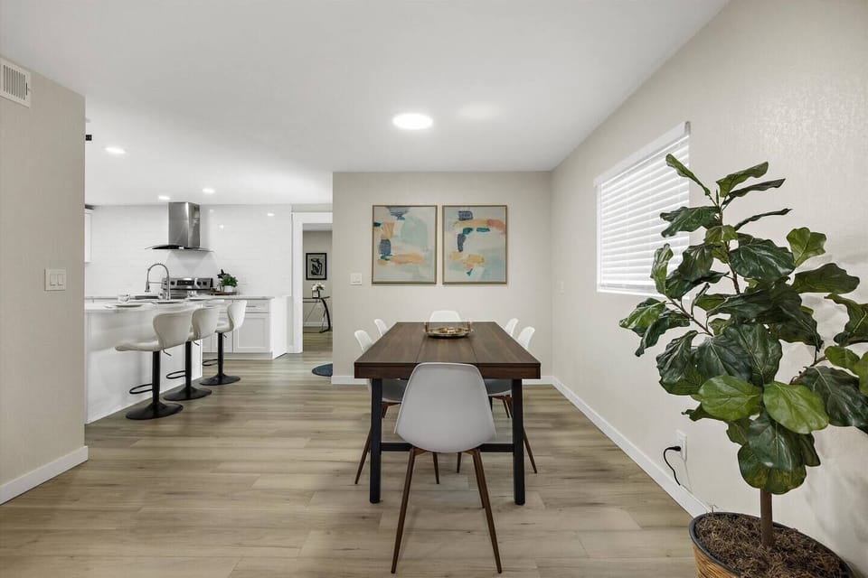 View from the living room to the dining area and the kitchen. Gracious open space concept.
