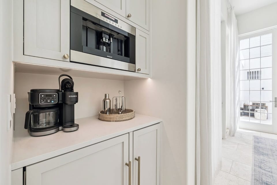 Built-in coffee bar with sleek modern finishes