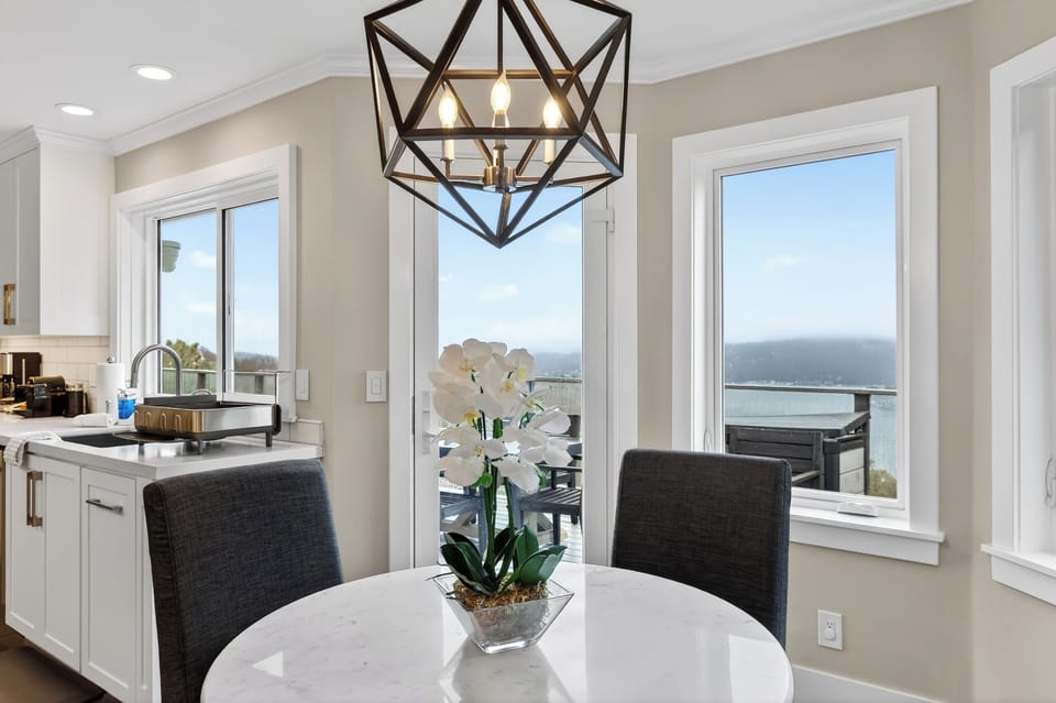 Circular breakfast nook with a contemporary geometric chandelier.