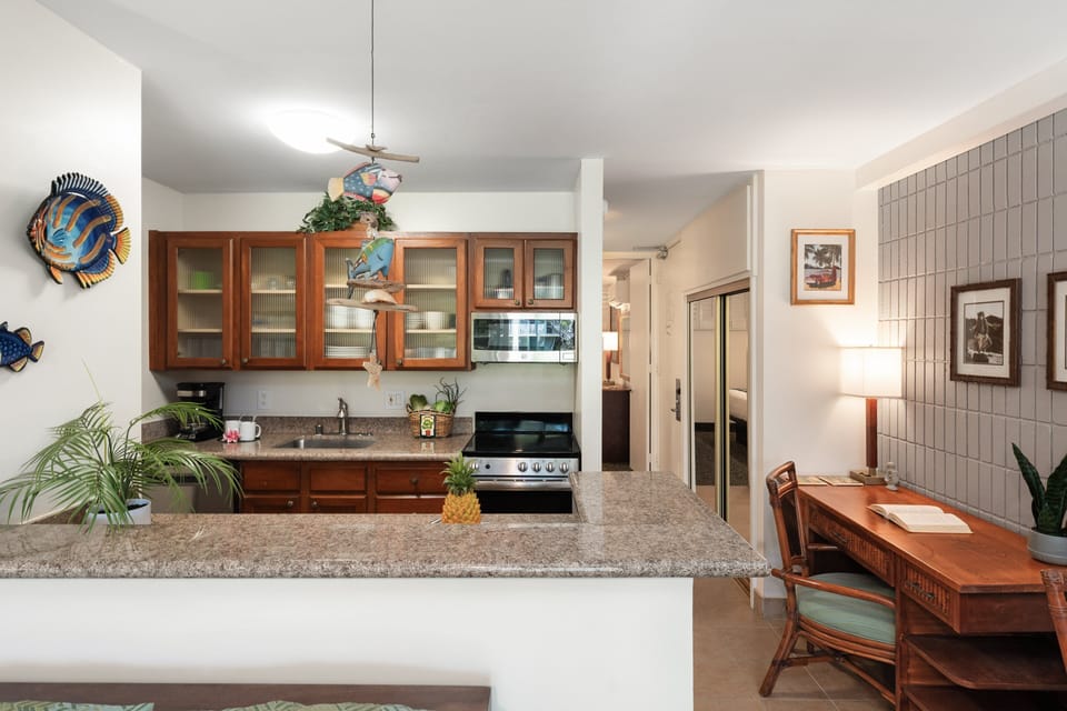 Remodeled kitchen with granite counters and a breakfast bar for casual meals.