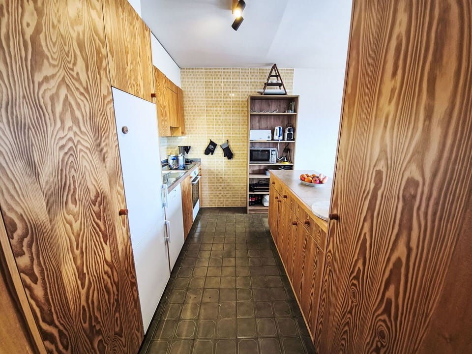 Flooring, Wood, Countertop, Interior Design, Floor, Kitchen, Cabinetry, Major Appliance, Furniture, Ceiling