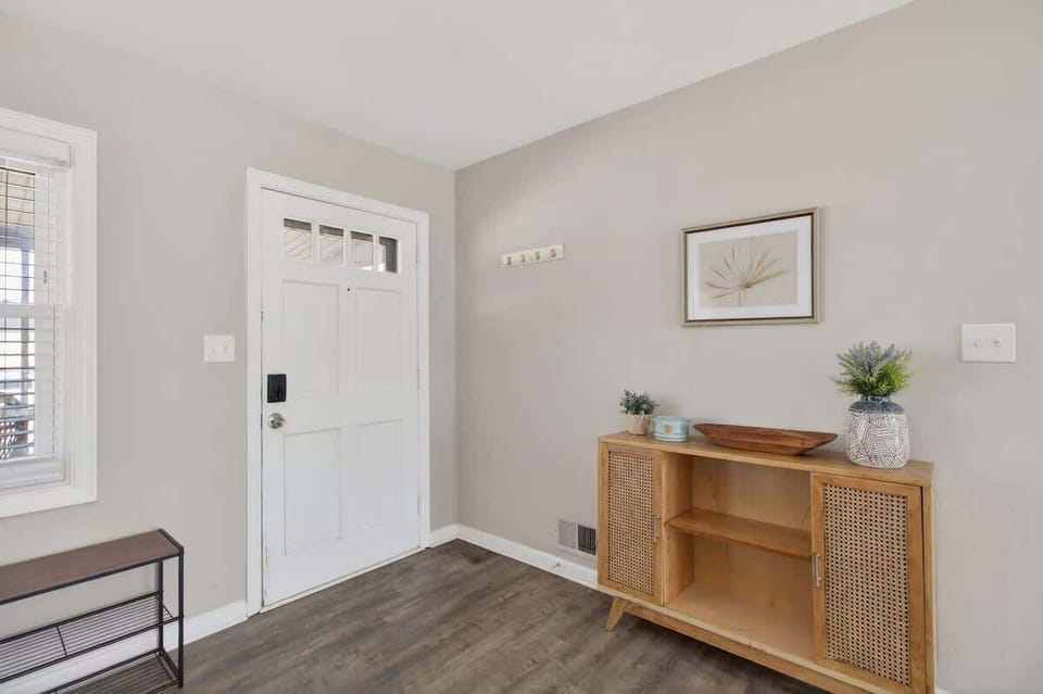 Bright and welcoming hallway leading into the home.