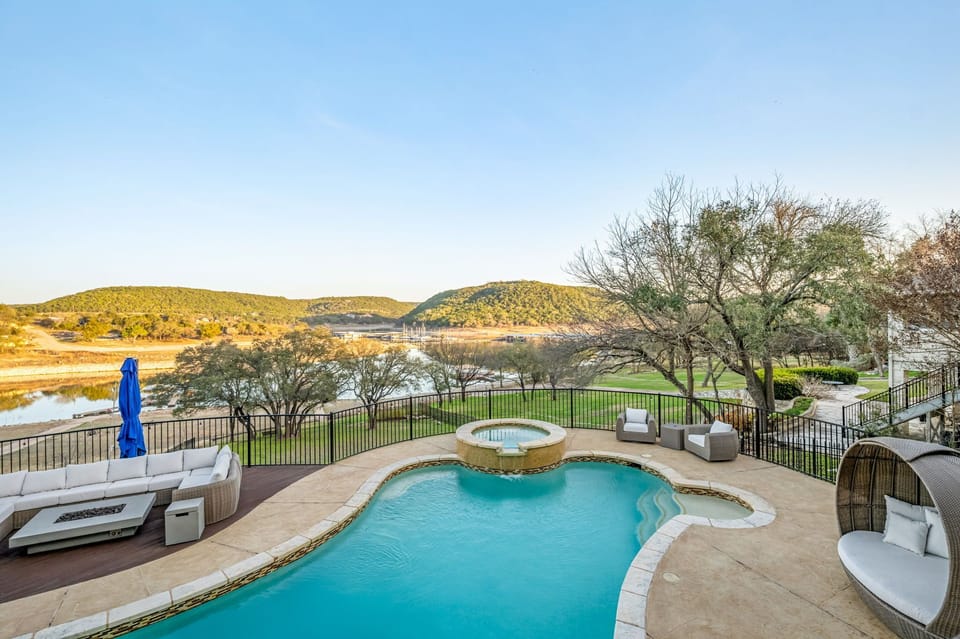 Resort-style pool and spa overlooking the lake — the ultimate outdoor retreat for your group stay.