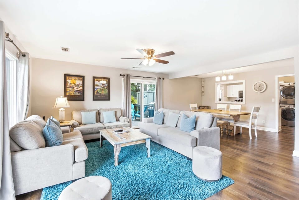 The full open floor plan flows from kitchen to dining to living, keeping everyone together whether you're cooking, eating, or lounging.