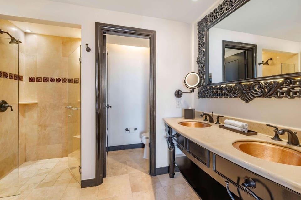 Refresh in a spa-like bath with double copper sinks.