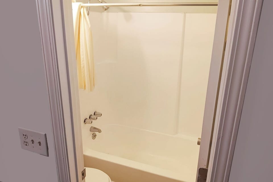 Refresh with a simple tub shower after a long day.