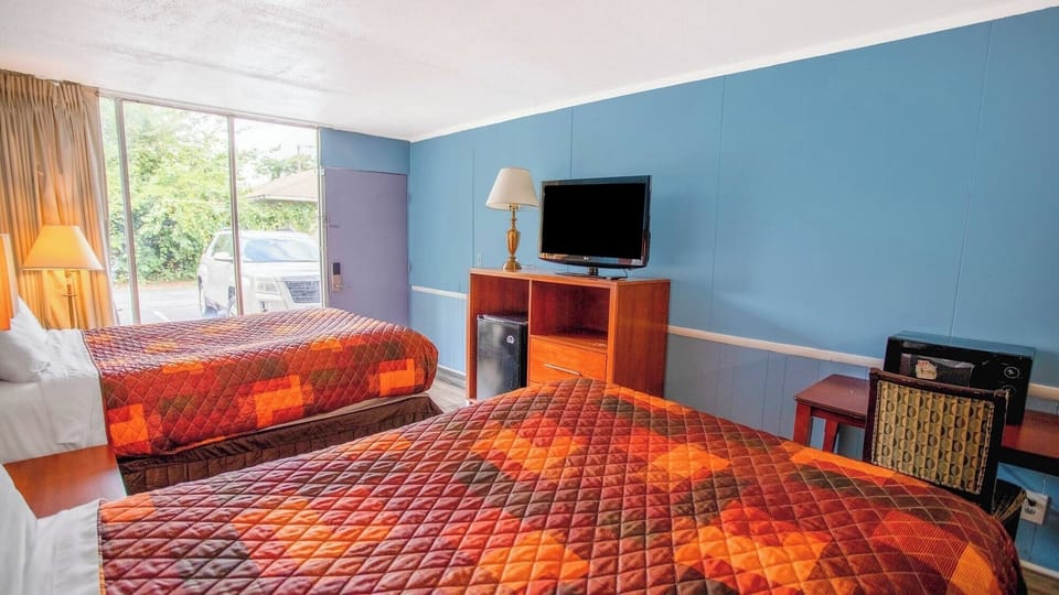 Kick back with in-room TV and easy snack setup.