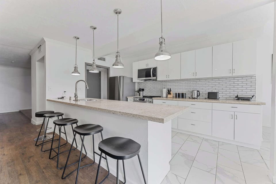 Bright and open kitchen with bar stool area