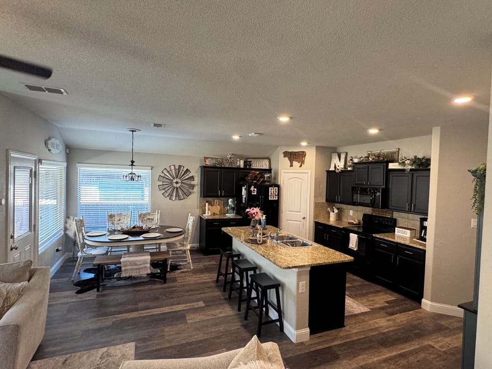 The kitchen is fully equipped with essential appliances, cookware, and utensils.