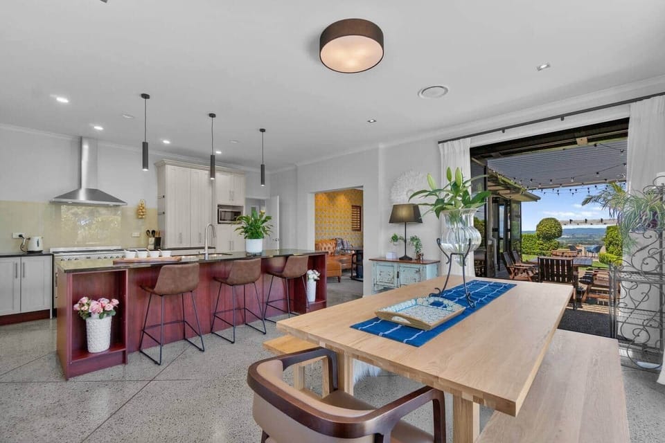 Open plan dining and kitchen with indoor and outdoor flow