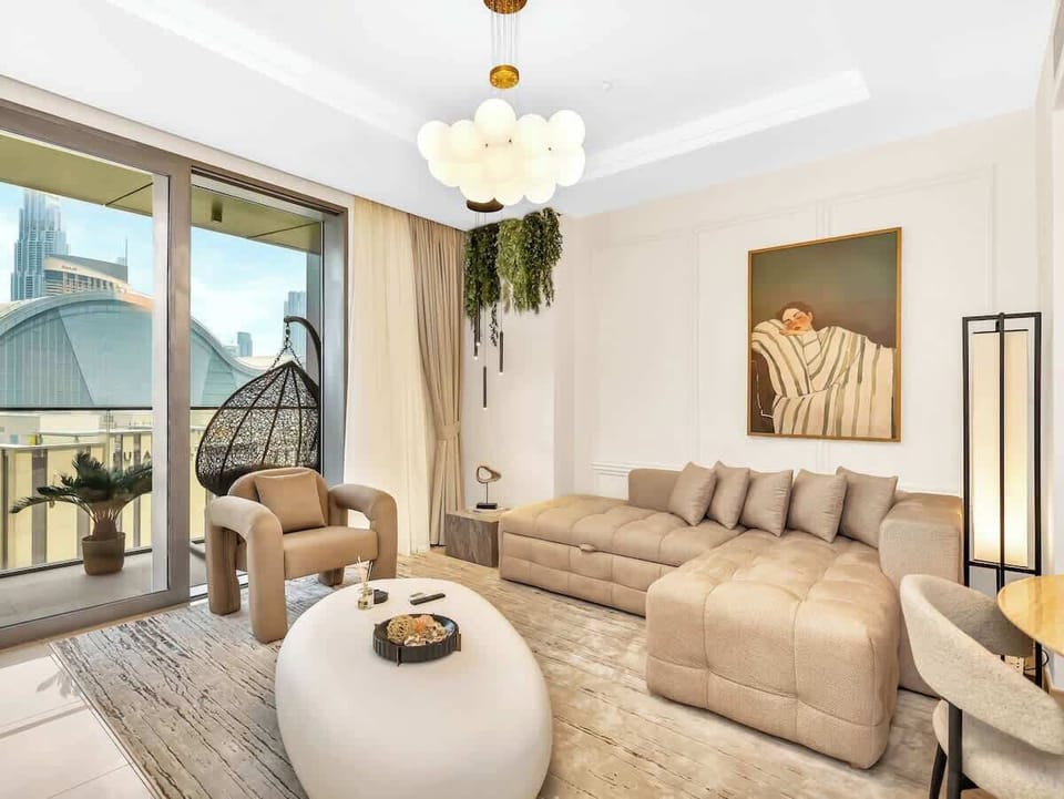 Chic and functional, this designer living room features a stylish pull-out sofa; perfect for lounging by day and hosting guests in comfort. Mattress topper available upon request. 
