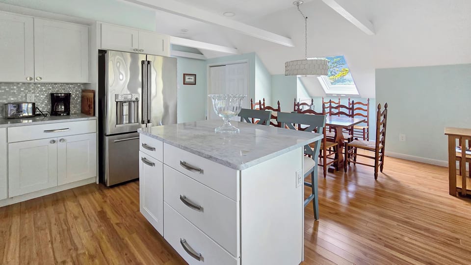 Nicely equipped kitchen with stainless appliances and center island