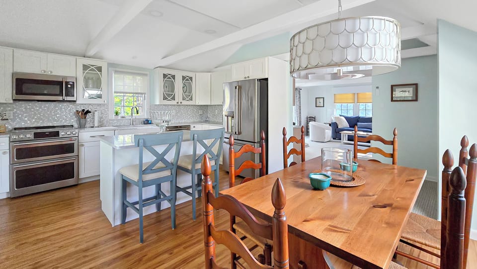 Dining area with kitchen and living room beyond