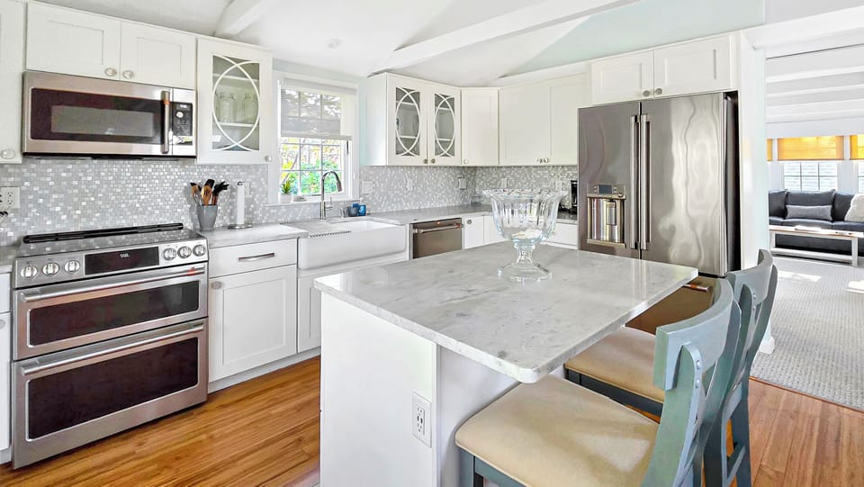 Nicely equipped kitchen with stainless appliances and center island