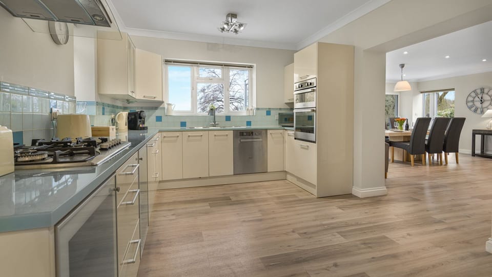 Open to the dining room, the kitchen is well equipped for your stay.