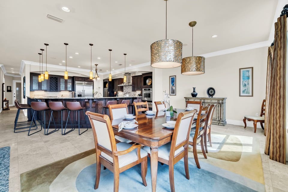 The dining table offers seating for eight, perfect for shared meals and easy conversation.