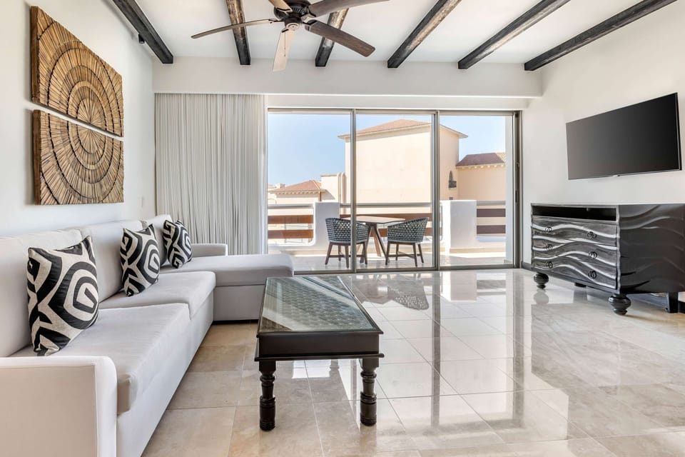 Relax together on plush seating with a big-screen setup.